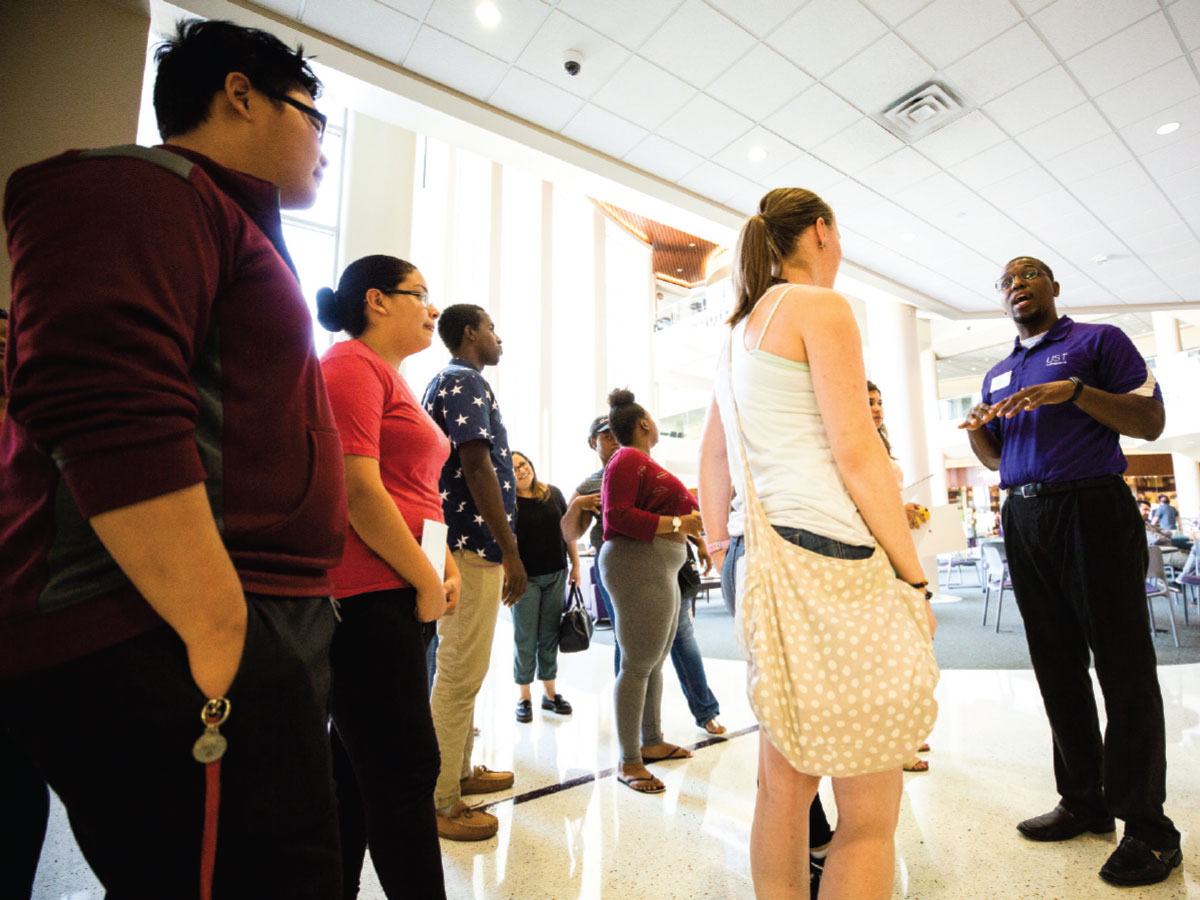 Teron Buford leads a tour of two-year Dougherty Family College at UST.